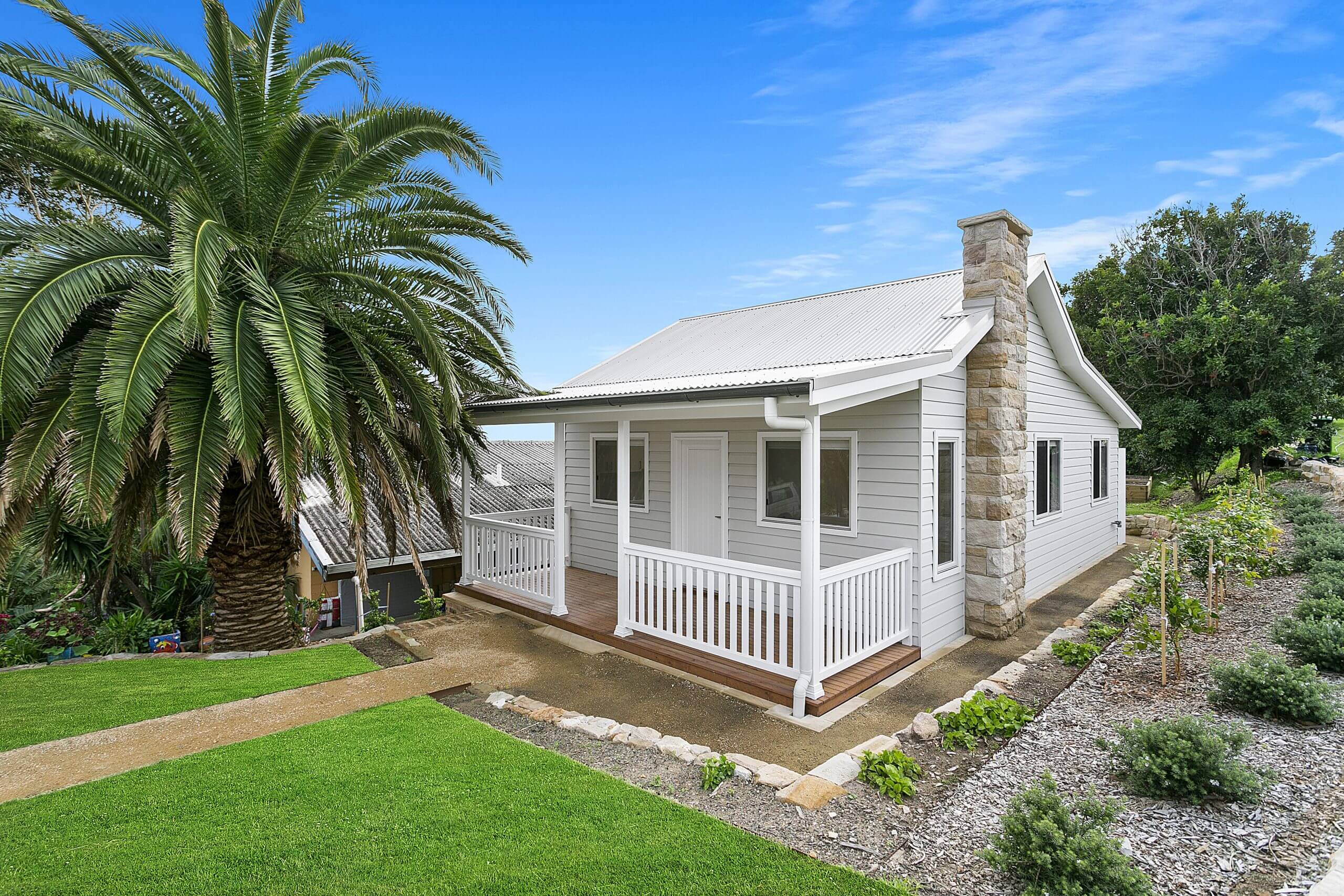 granny flat with white picket deck
