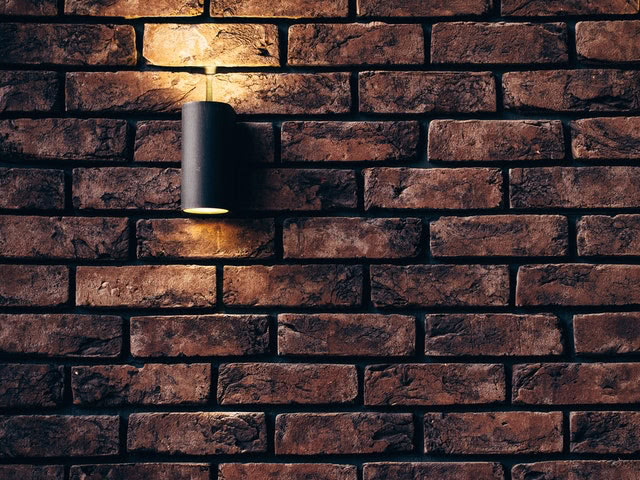 Light on brick wall of granny flat rental