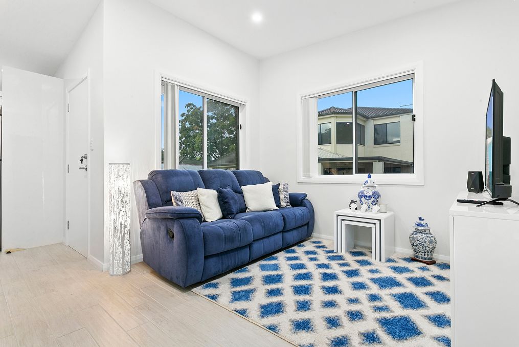 Blue couch and rug in granny flat living room