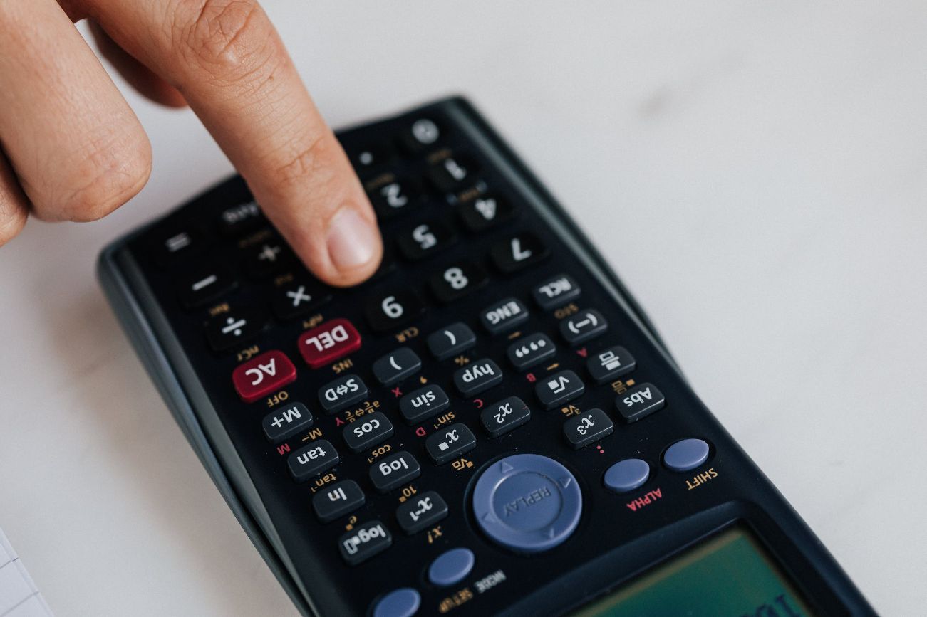 Finger pressing calculator button