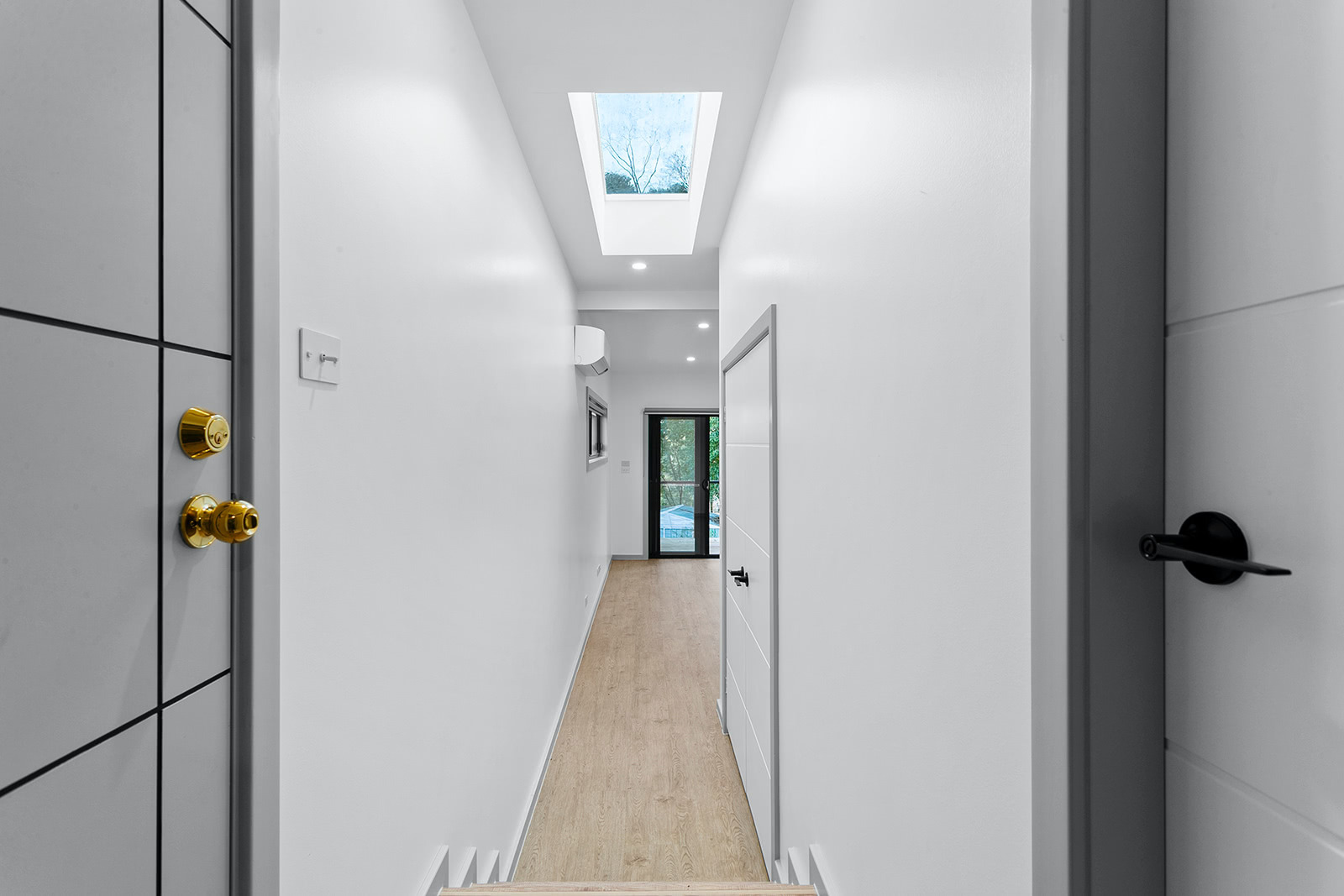 White corridor with skylight