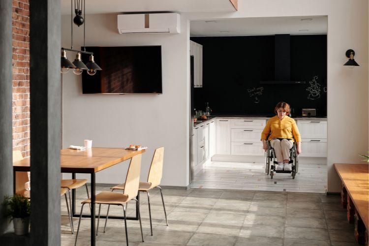 woman in a wheelchairs in a kitchen